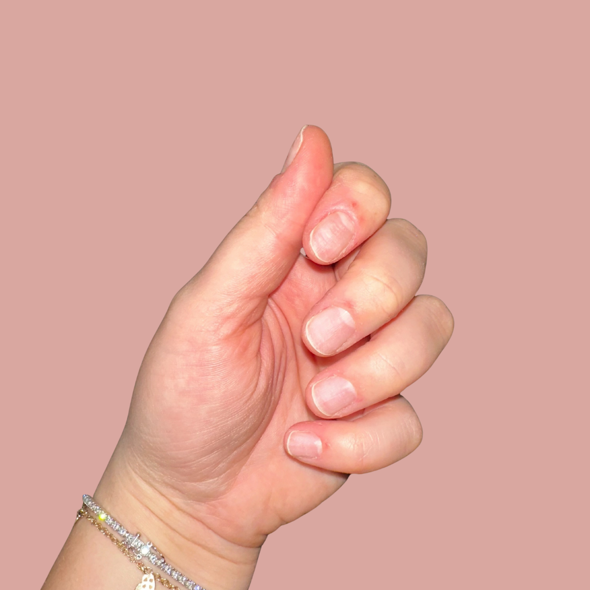 Natural nails before applying reusable gel press-on nails.