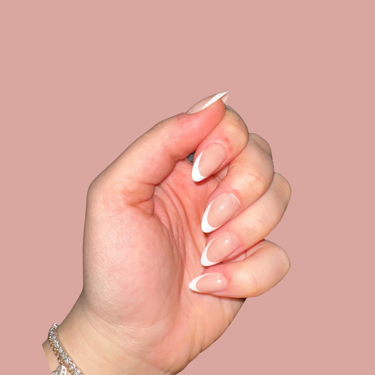 Soft neutral almond-shaped press-on nails after full application.