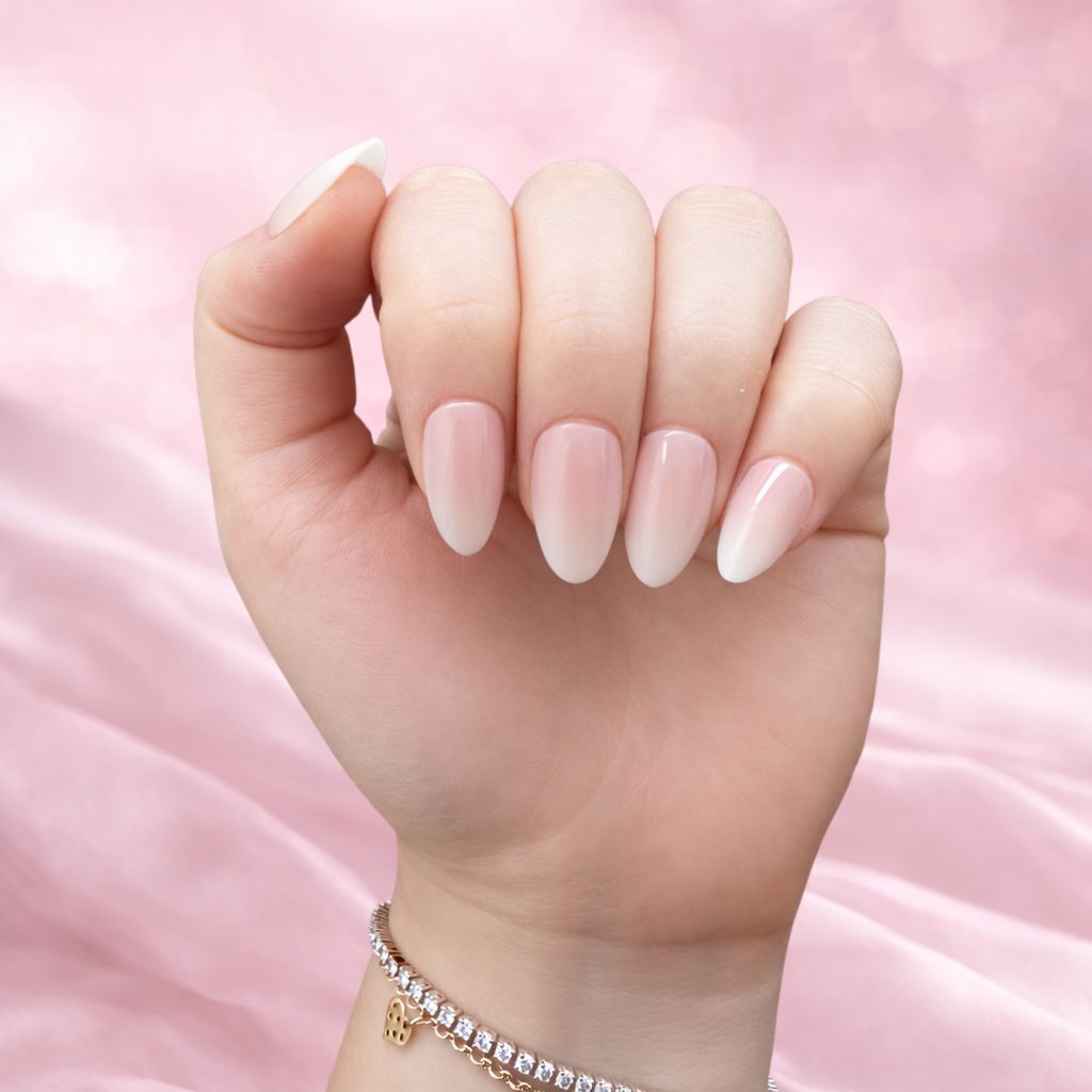 Hand with gradient nail polish on a pink background